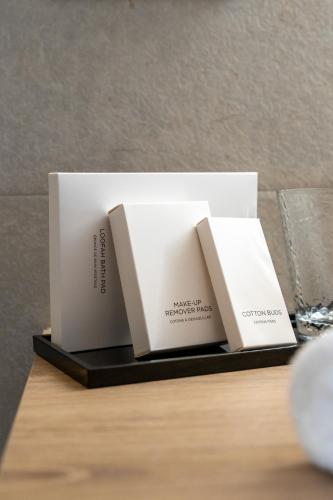 two white boxes sitting on top of a table at Suites By Le Rêve in Tangier