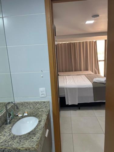 Postel nebo postele na pokoji v ubytování Manaíra Apart Hotel
