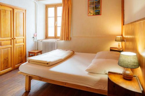 Postel nebo postele na pokoji v ubytování Auberge l'Estoilies