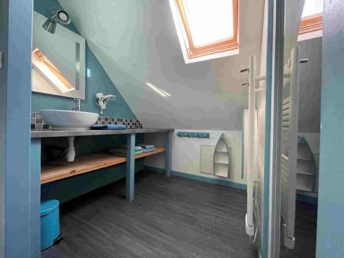 a bathroom with a sink and a mirror at La Grange de Melaual in Soulages-Bonneval