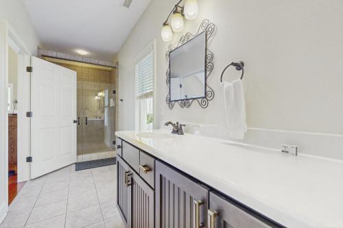 a bathroom with a sink and a mirror at 2BNWaves #2-W in Waves