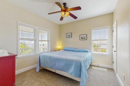a bedroom with a bed and a ceiling fan at 2BNWaves #2-W in Waves