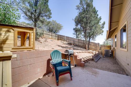 a patio with a table and chairs and a fence at Stunning Mountain Views Peaceful Payson Retreat! in Payson