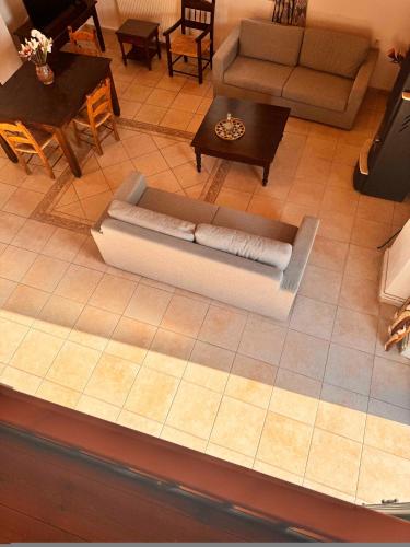 an overhead view of a living room with a couch at Skandalis Apartments with pool in Chorafakia