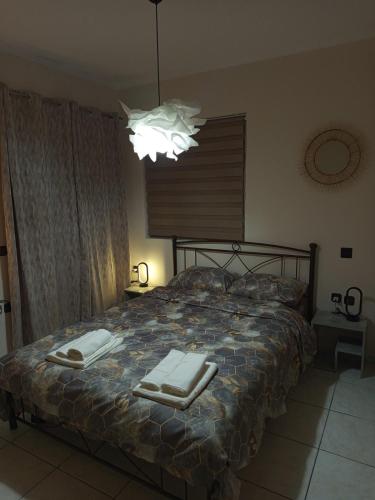 Ένα ή περισσότερα κρεβάτια σε δωμάτιο στο Chrysa's house