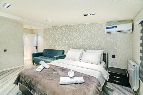 Ένα ή περισσότερα κρεβάτια σε δωμάτιο στο Sahil Skyline Suite Apartment by Baku Housing
