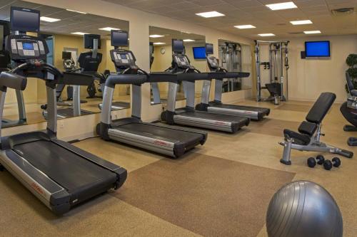 a gym with treadmills and elliptical machines at Marriott Savannah Riverfront in Savannah