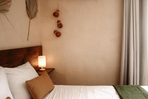 Postel nebo postele na pokoji v ubytování Hotel Casa Nudo, Mérida