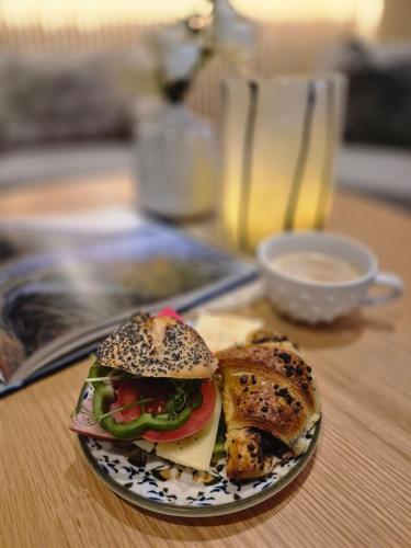 a sandwich on a plate on a table at Hotell Rådhuset in Lidköping