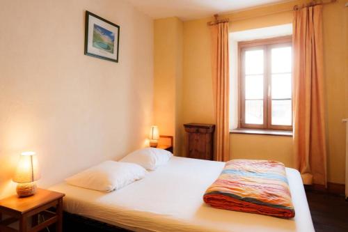 Postel nebo postele na pokoji v ubytování Auberge l'Estoilies