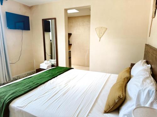 Postel nebo postele na pokoji v ubytování Hotel Casa Nudo, Mérida