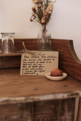 a plate of food on a table with a sign at Garenne in Livron-sur-Drôme