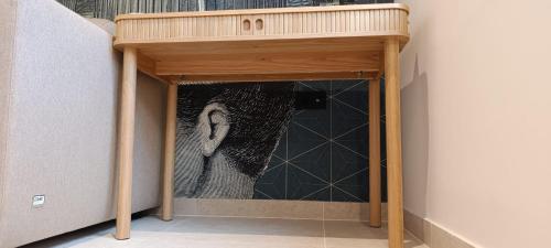 a wooden door in a room with a painting at Adria in Opatija