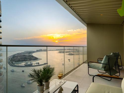 a balcony with a view of the ocean at Utra Lux Large 1 BR with Sunset Views and Private Beach in Dubai