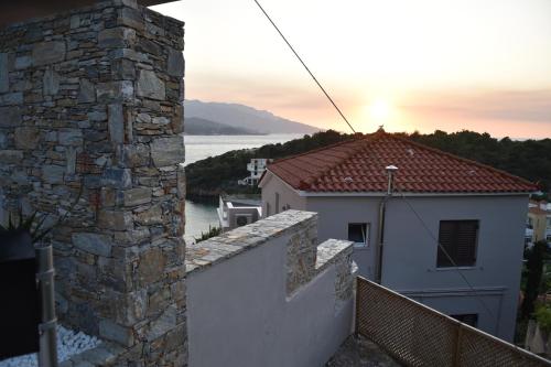 a view of a house with a stone wall at Samos Endless Blue 2 in Samos