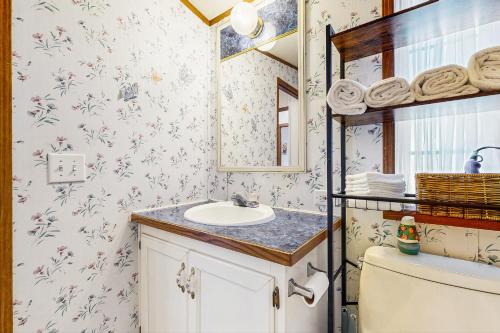a bathroom with a sink and a toilet at Assateague Point Vacation in Berlin