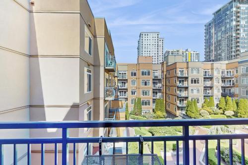 a balcony with a view of buildings at Sapphire of Belltown Court in Seattle