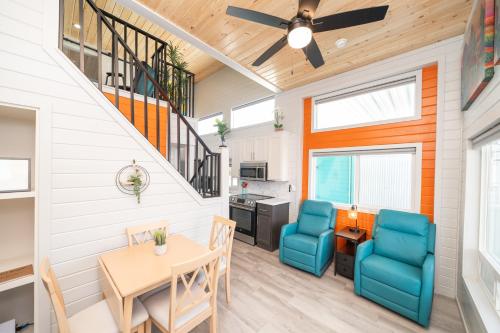 a kitchen and dining room with a table and chairs at Dock Holiday, River Views at Roadrunner Resort in Parker