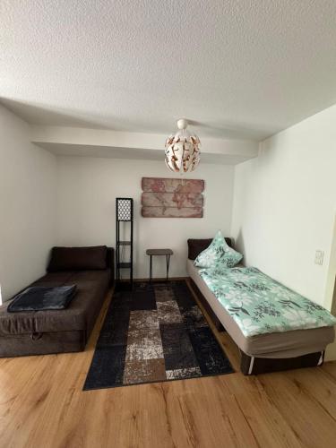 a living room with a bed and a couch at Apartment Altstadt in Pirna