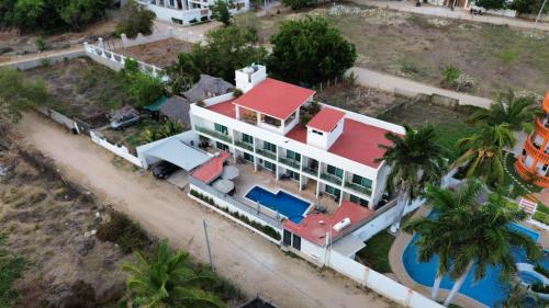 an aerial view of a house with a swimming pool at PETRAS HOTEL in Brisas de Zicatela