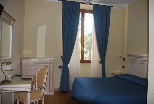 Postel nebo postele na pokoji v ubytování Hotel Primula
