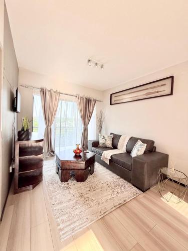 Posezení v ubytování Dream Orchards Broadacres Apartment