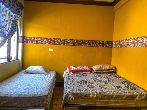 Postel nebo postele na pokoji v ubytování Hotel Henderson