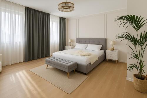 a bedroom with a bed and a potted plant at Luna Luxury Suite in Bergamo