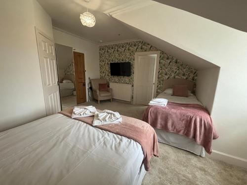 Un ou plusieurs lits dans un hébergement de l'établissement Grangeview Guest House