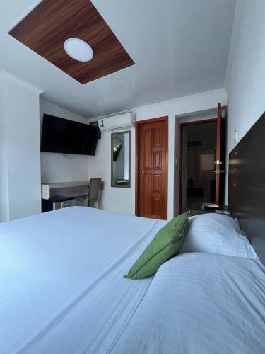 Un ou plusieurs lits dans un hébergement de l'établissement Villa Santos Apartaestudios