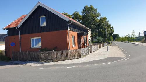 a small house on the side of a street at Sahlin - Kattarp in Kattarp