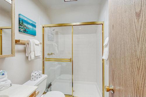 a bathroom with a shower and a toilet at Poma Lane in Soda Springs