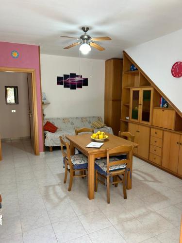 a kitchen and dining room with a table and chairs at Casa Vacanze Giulia in Maratea
