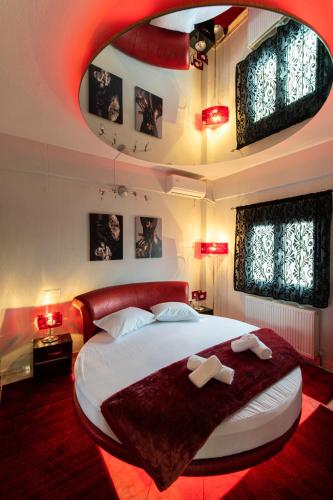 a bedroom with a large bed with two towels at Luxury Home Askos in Askós