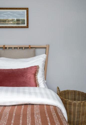 a bedroom with a bed and a picture on the wall at Brunstane House - 15 mins to City Centre in Edinburgh