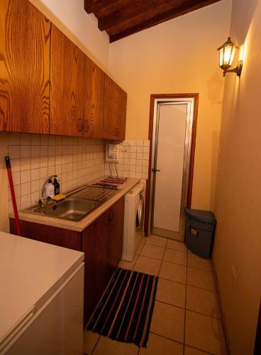 a kitchen with a sink and a counter top at Archontikon 1817 in Kaliana