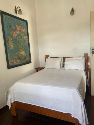 Una cama o camas en una habitación de Pousada Pouso do Sô Vigario