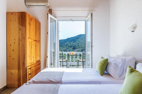 Ένα ή περισσότερα κρεβάτια σε δωμάτιο στο Kanaris Guesthouse