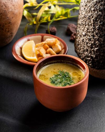 a bowl of soup and a bowl of food at Lacosta Hotel in Aqaba