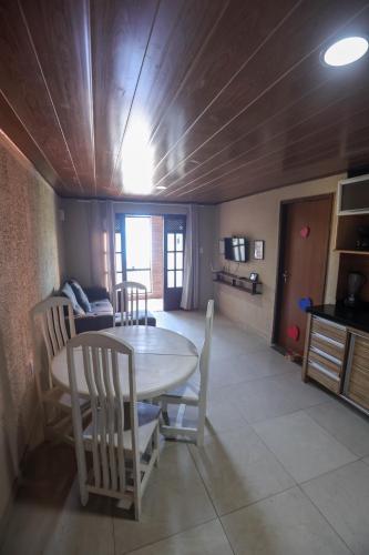 a dining room with a table and chairs at Na Jatiuca in Maceió