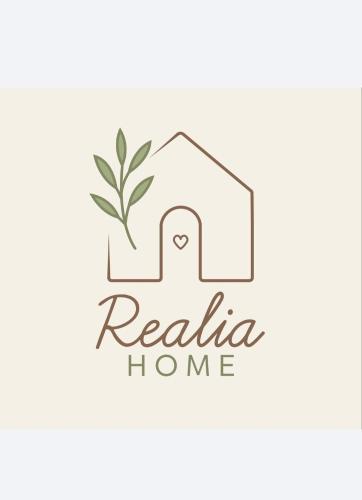a logo for a real estate home at Realia Home in Trani