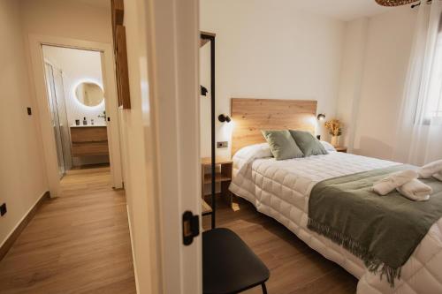 Una cama o camas en una habitación de Mar de Olivos Baeza