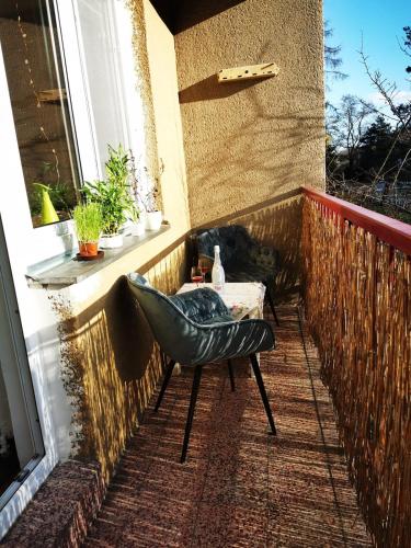 a chair and a table on a balcony at Star #5B515 in Brno