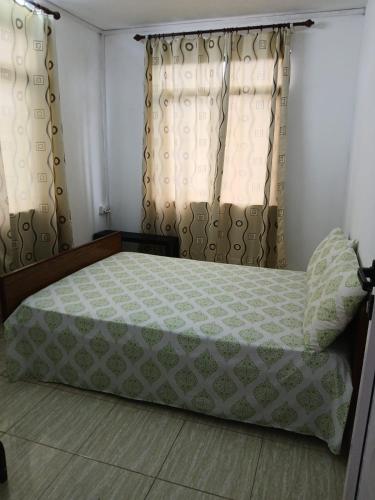 Postel nebo postele na pokoji v ubytování Gris Gris Guest House