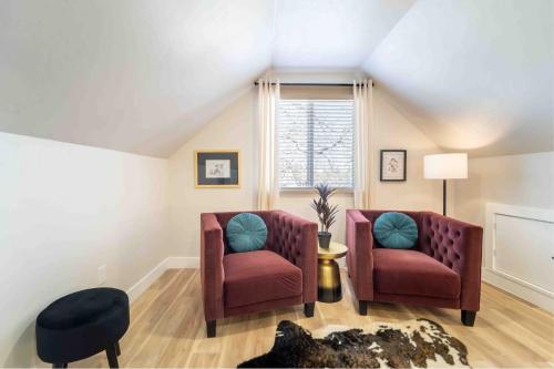 a living room with two chairs and a window at Morrison Getaway - 2BR House BBQ Free Parking in Morrison