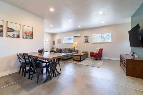 a dining room and living room with a table and chairs at Morrison Getaway - 2BR House BBQ Free Parking in Morrison