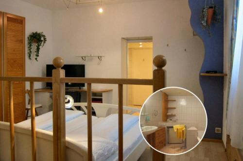 a bedroom with a bunk bed with a mirror at Pension Sonne Bed&Breakfast in Bregenz