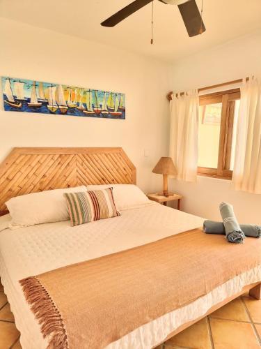 a bedroom with a large bed and a window at Mancora Beach Hotel in Máncora