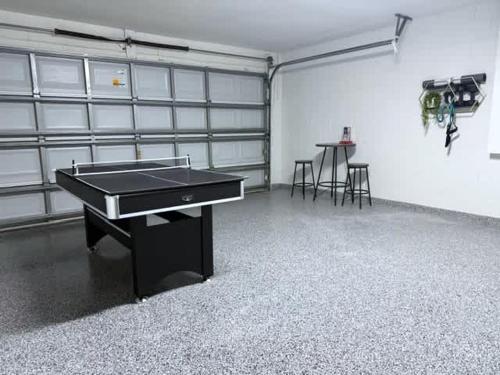an empty room with a ping pong table in it at Beautiful South-Facing Pool Home in Southern Dunes in Haines City