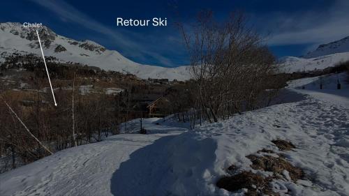 a snow covered slope with trees and a mountain at Chalet 6 à 8pers pied des pistes, piscine et vue in Saint-François-Longchamp